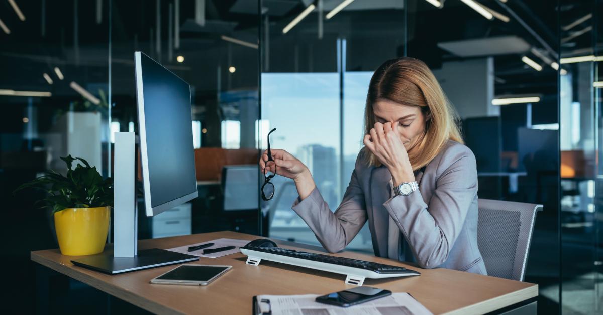 A tired businesswoman working at the office.