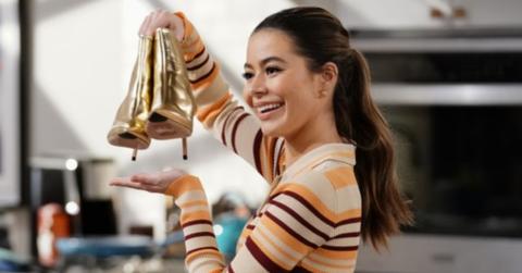 Carly showing off a pair of shoes.