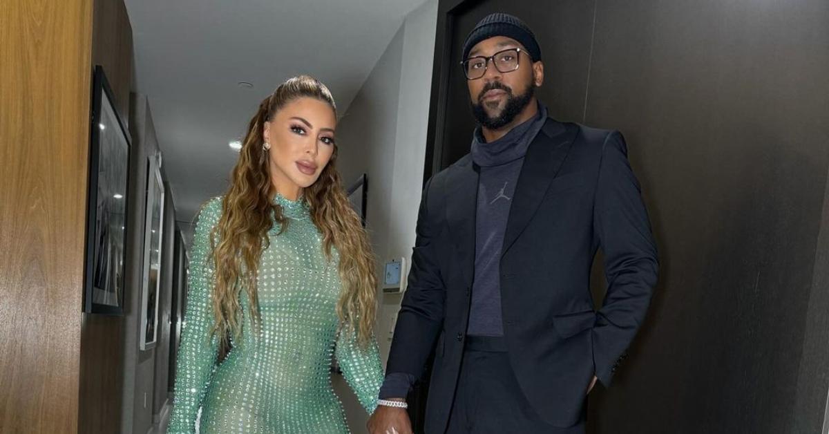 Larsa Pippen and Marcus Jordan holding hands