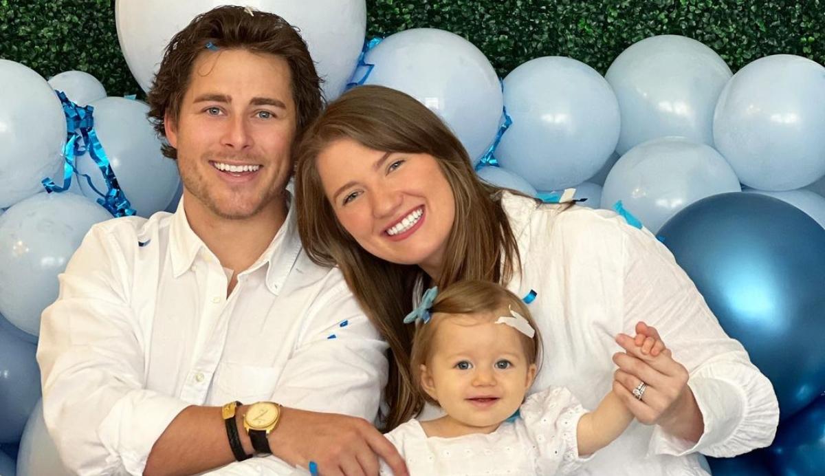 Cody and Madlyn with their daughter celebrating their second baby’s gender reveal