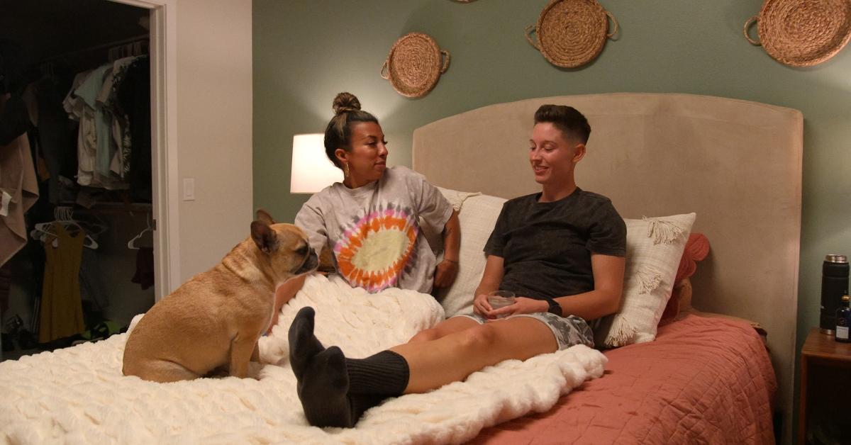 Yoly and Xander lay in bed together on 'The Ultimatum: Queer Love'