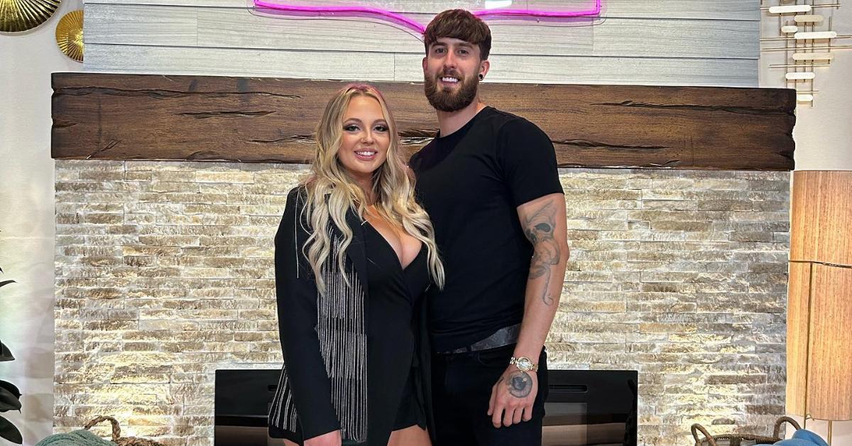 Jade Cline and Sean Austin pose in front of a 'Teen Mom: The Next Chapter' sign.