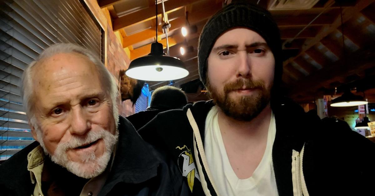 Asmongold with his dad in a restaurant.