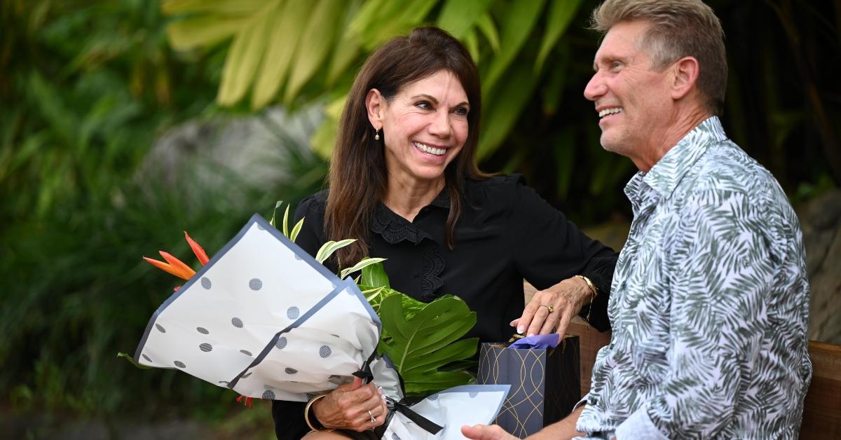 Theresa Nist and Gerry Turner sit together on a bench