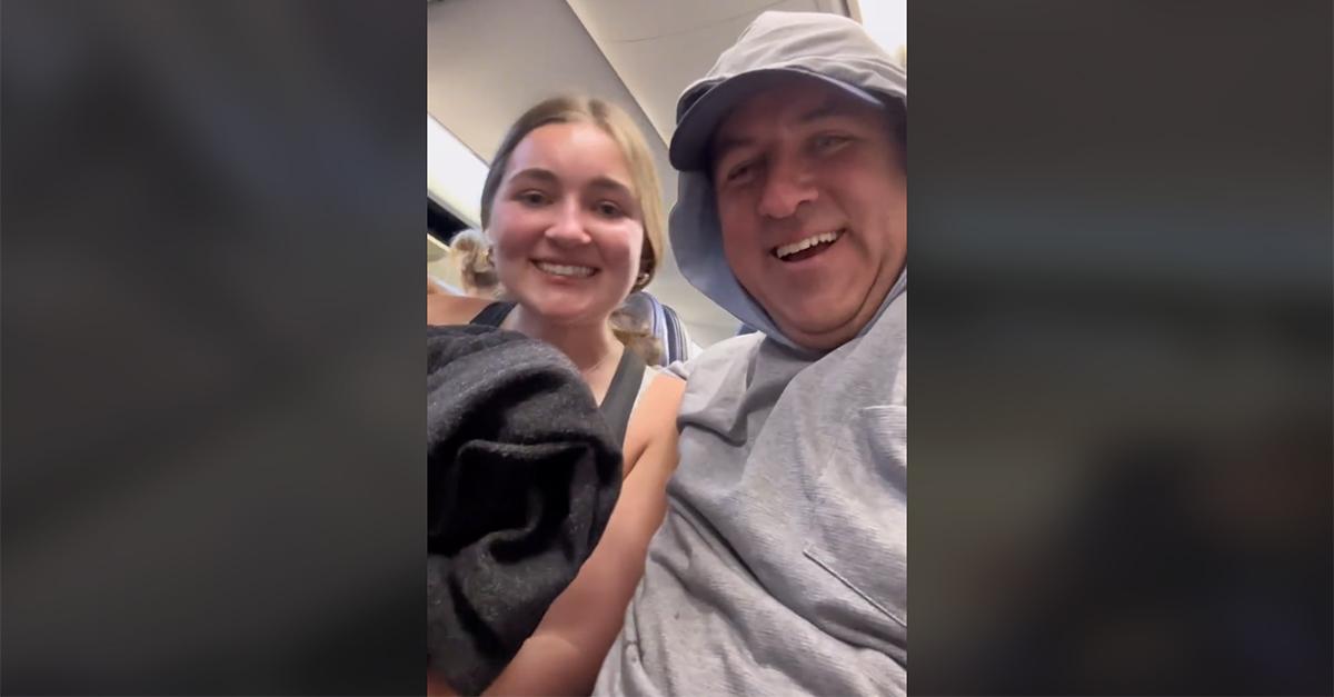 tiktok dad surprises daughter on airplane with phone filming