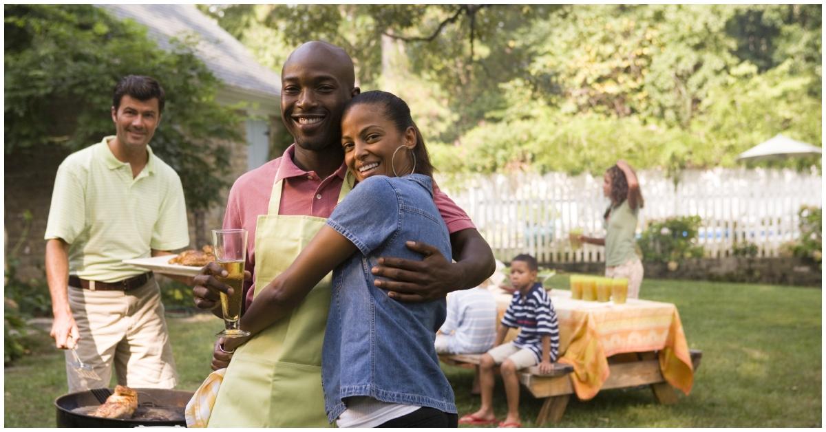 A cookout with a Black couple and white man