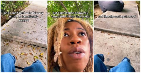 A woman in a wheelchair showing how an uneven sidewalk is a major issue