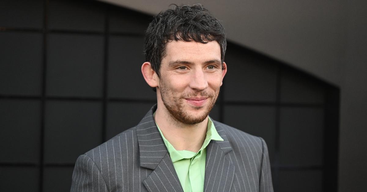 Josh O'Connor wearing green shirt and striped jacket at the "Challengers" LA Premiere in April 2024