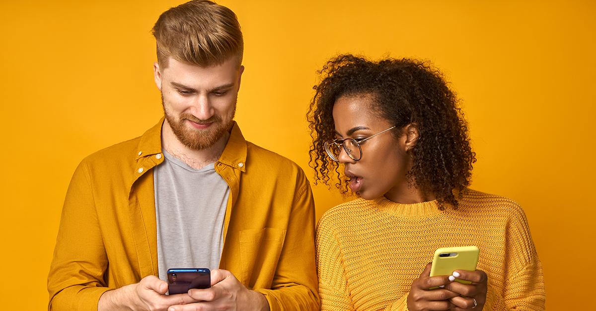 Woman looking at man's phone