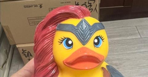 Allison Parliament holding a custom designed rubber duck.