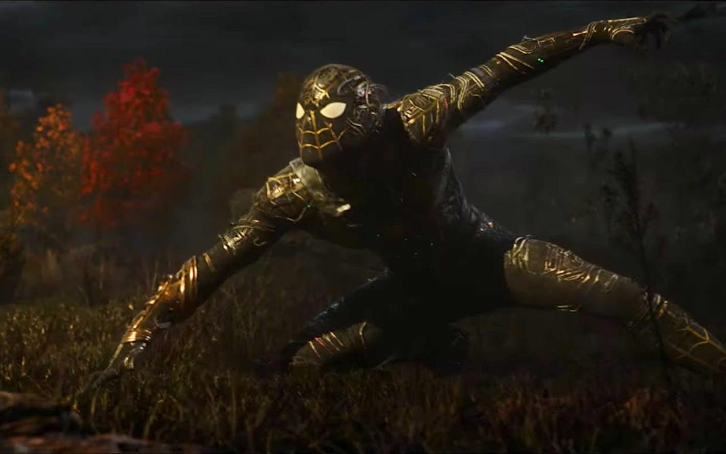 Spider-Man wears the new black and gold suit in battle.