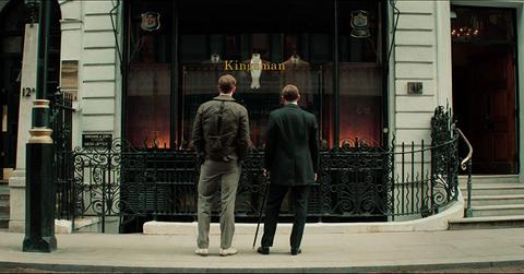 Duke Oxford and his son Conrad standing out the Kingsman tailor shop.
