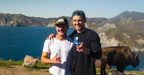 Zac Efron with his brother David posing together outside.