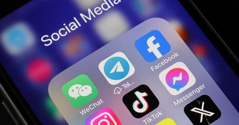 Social media apps on a phone, including TikTok.