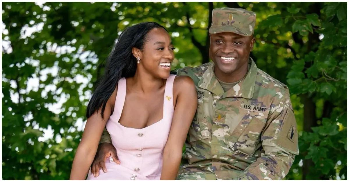 Silas Cooper sitting next to his wife and wearing his military uniform