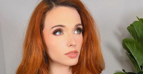 A close-up of Amouranth looking away from the camera.