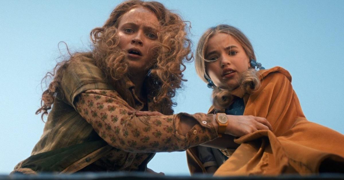 Max and Holly stare down an abandoned mine shaft in Stranger Things.