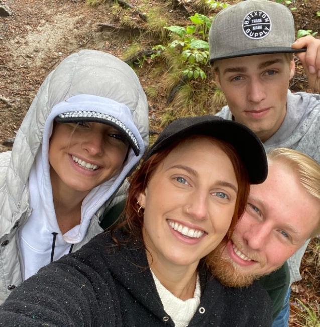 Moriah, Olivia, Micah, and Ethan Plath hiking in the woods