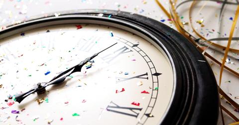 The clock strikes midnight, thus commencing the New Year.