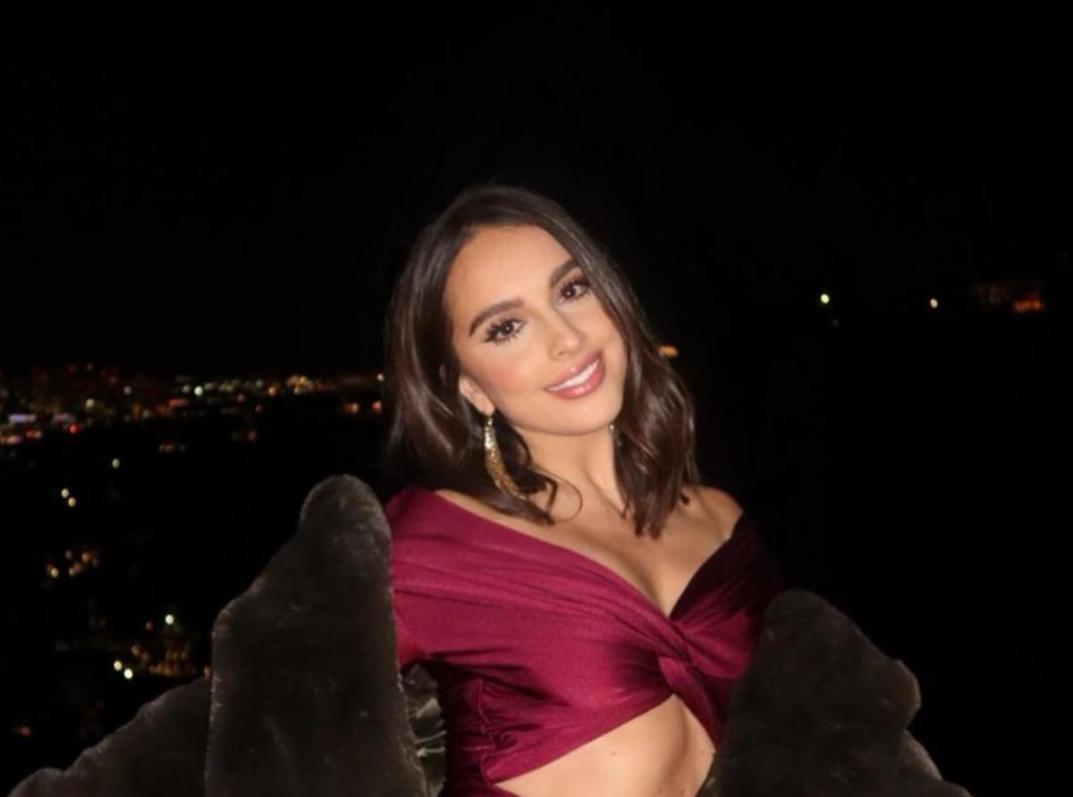 Alexia Umansky wearing a red top and fur coat