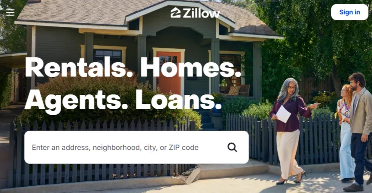 Zillow's home page shows a realtor showing a home to a man and a woman.