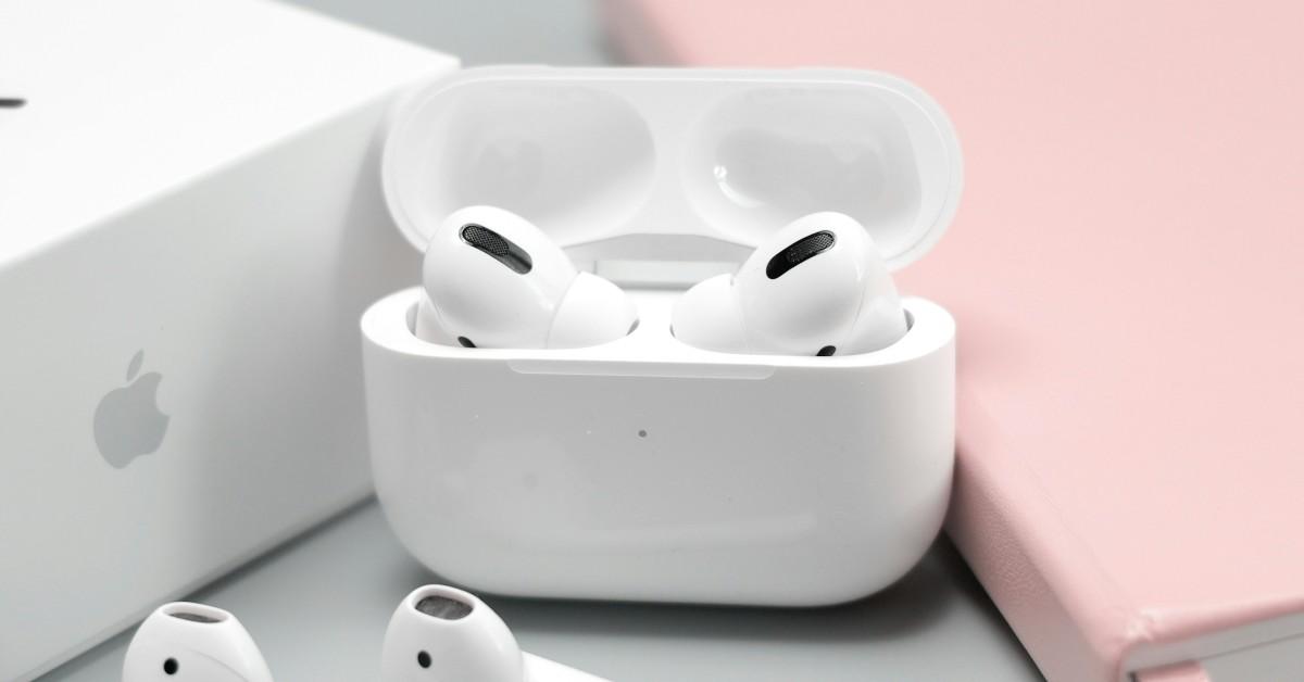 AirPods sitting in a case on a table