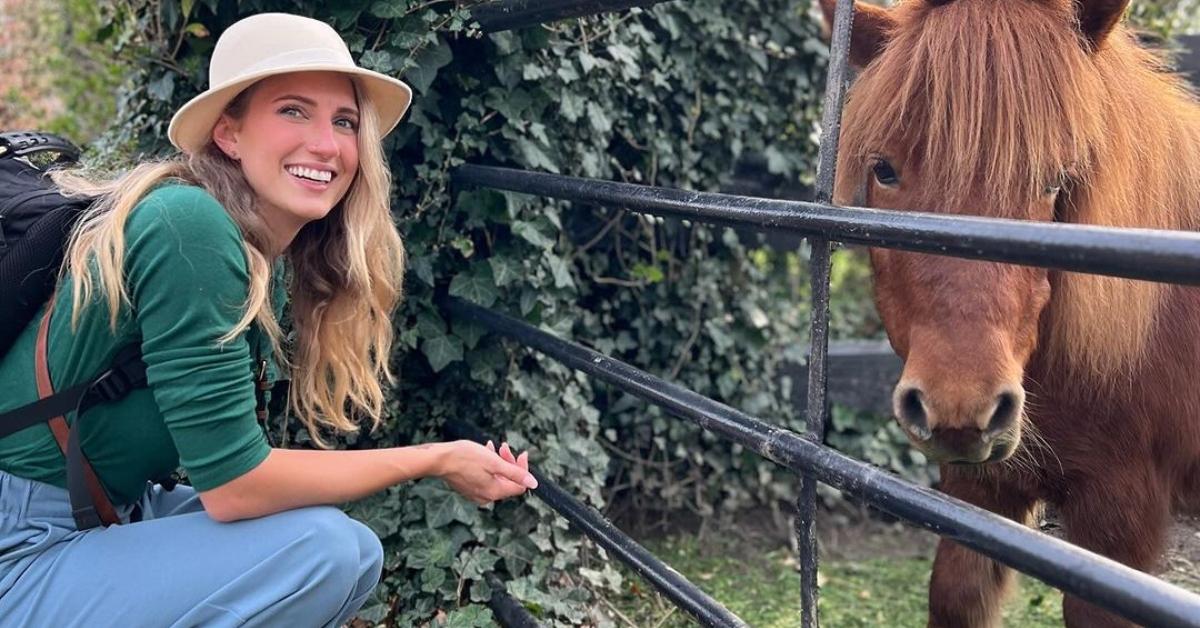 Olivia Plath with a horse on a farm in the Netherlands