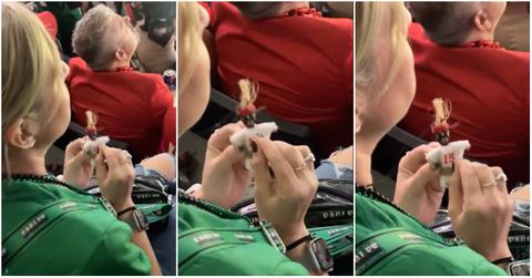 Eagles fan poking a Chiefs voodoo doll at 2025 Super Bowl.