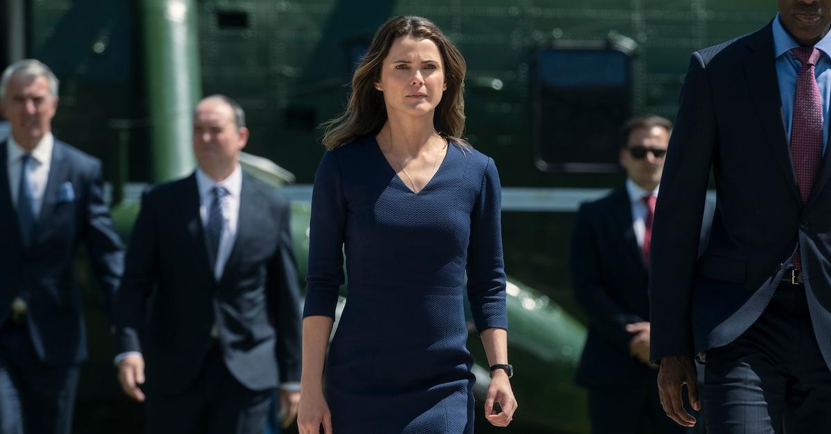 Keri Russell walks on the tarmac in a scene from 'The Diplomat'.