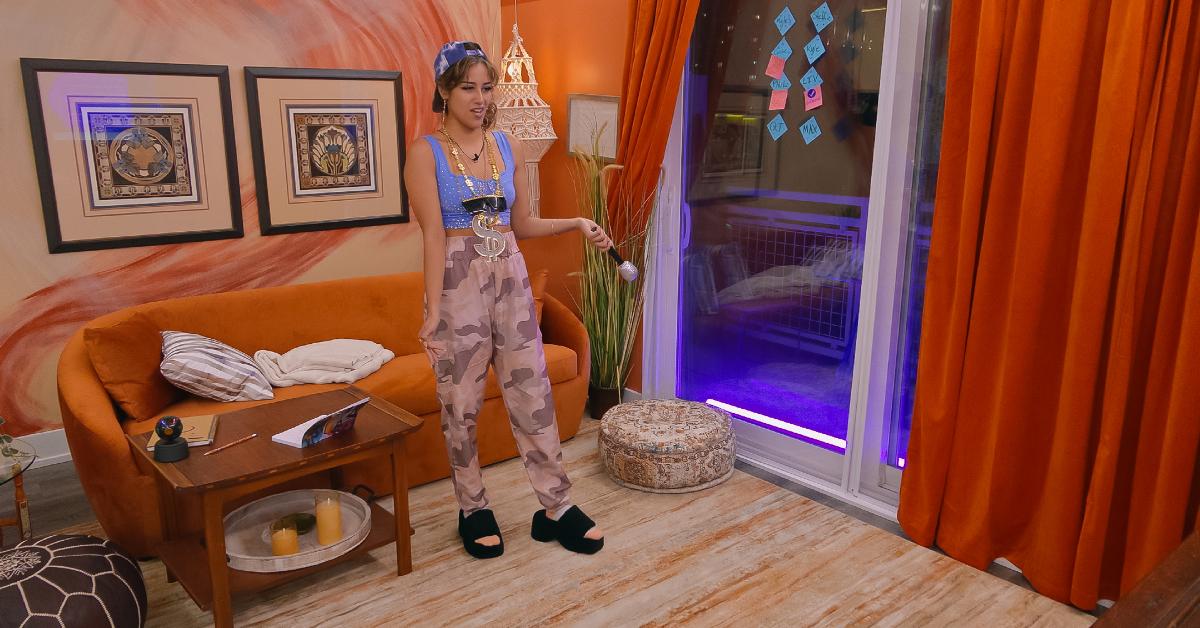 Lauren LaChant stands in front of her couch during the rap challenge in Season 6 of 'The Circle.'