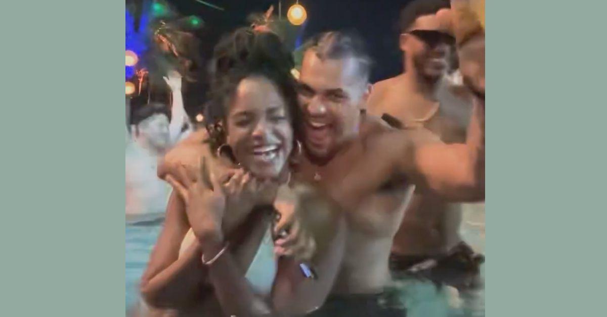 Screen grab of a video shared via reddit of Nia Moore and Josh Martinez in a pool laughing in a semi-intimate pose