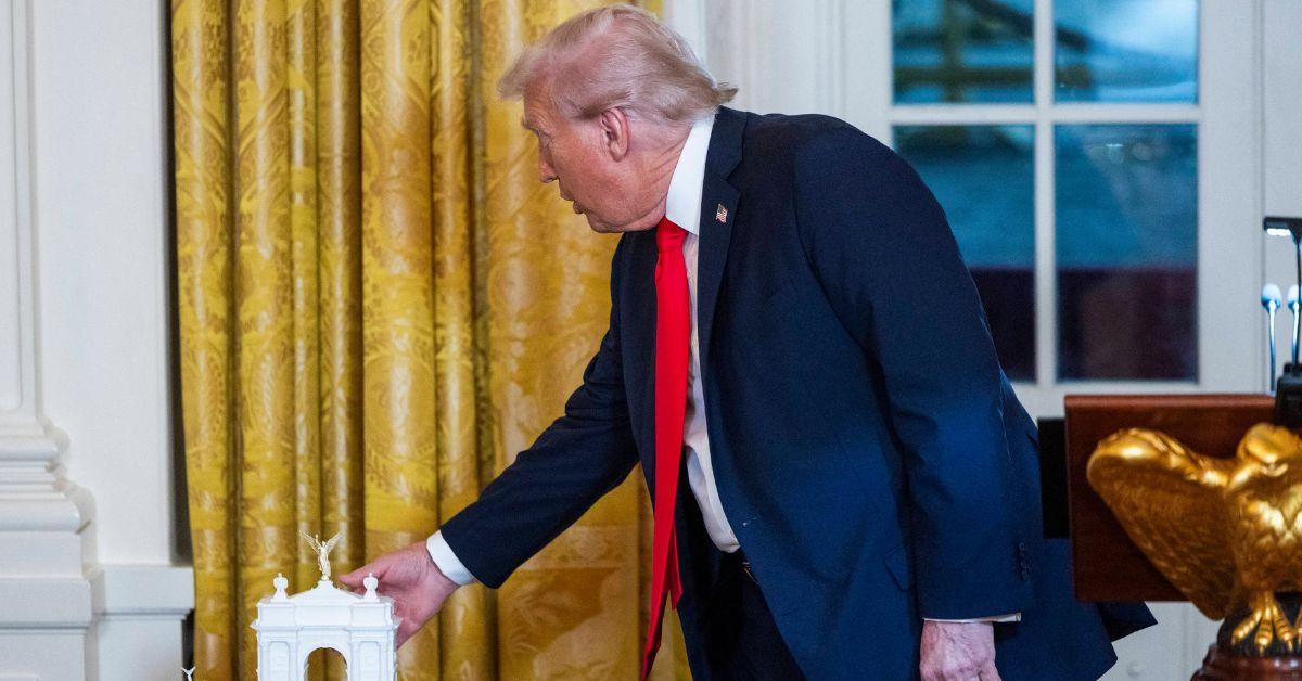 Donald Trump showcasing initial designs for his arch.