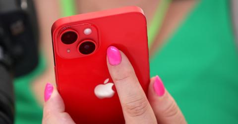 An attendee holds a new iPhone 14 during an Apple special event on September 07, 2022