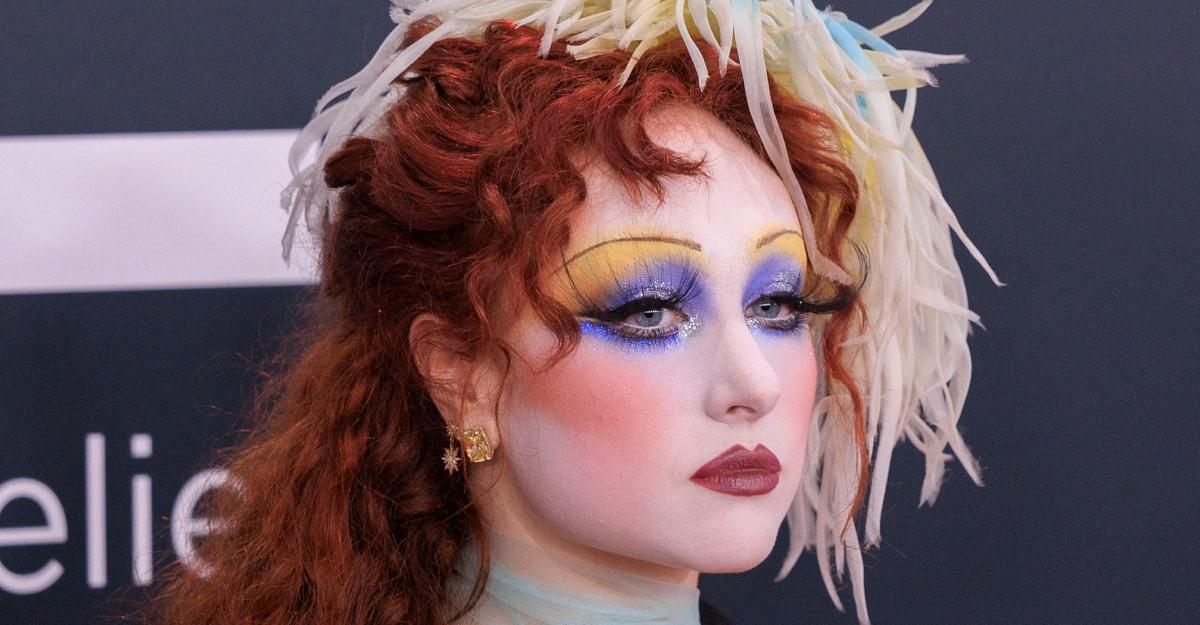 Chappell Roan wears a feathered headpiece to the 2025 Grammy Awards.