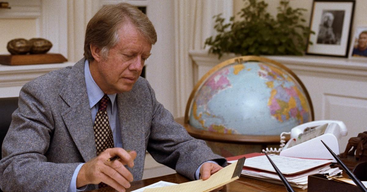 Jimmy Carter doing paperwork in an old photo