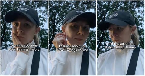 TikToker showing off her pearl earrings.