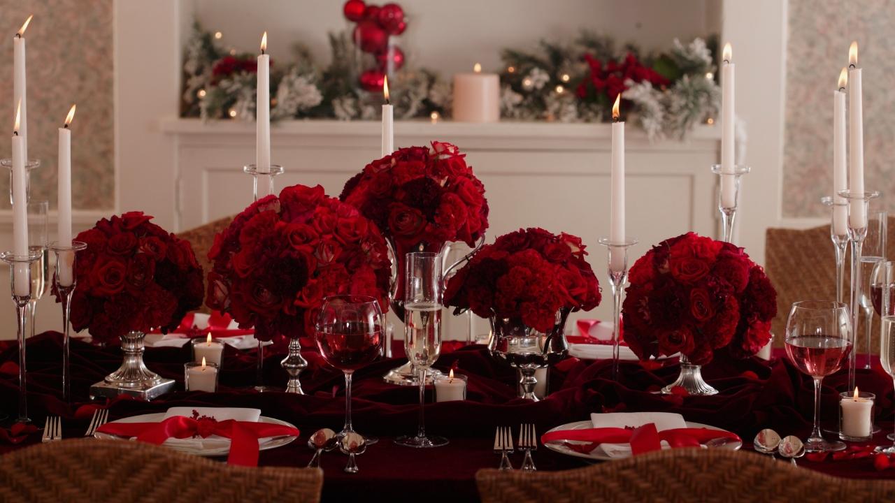 red roses on a dining room table with candles