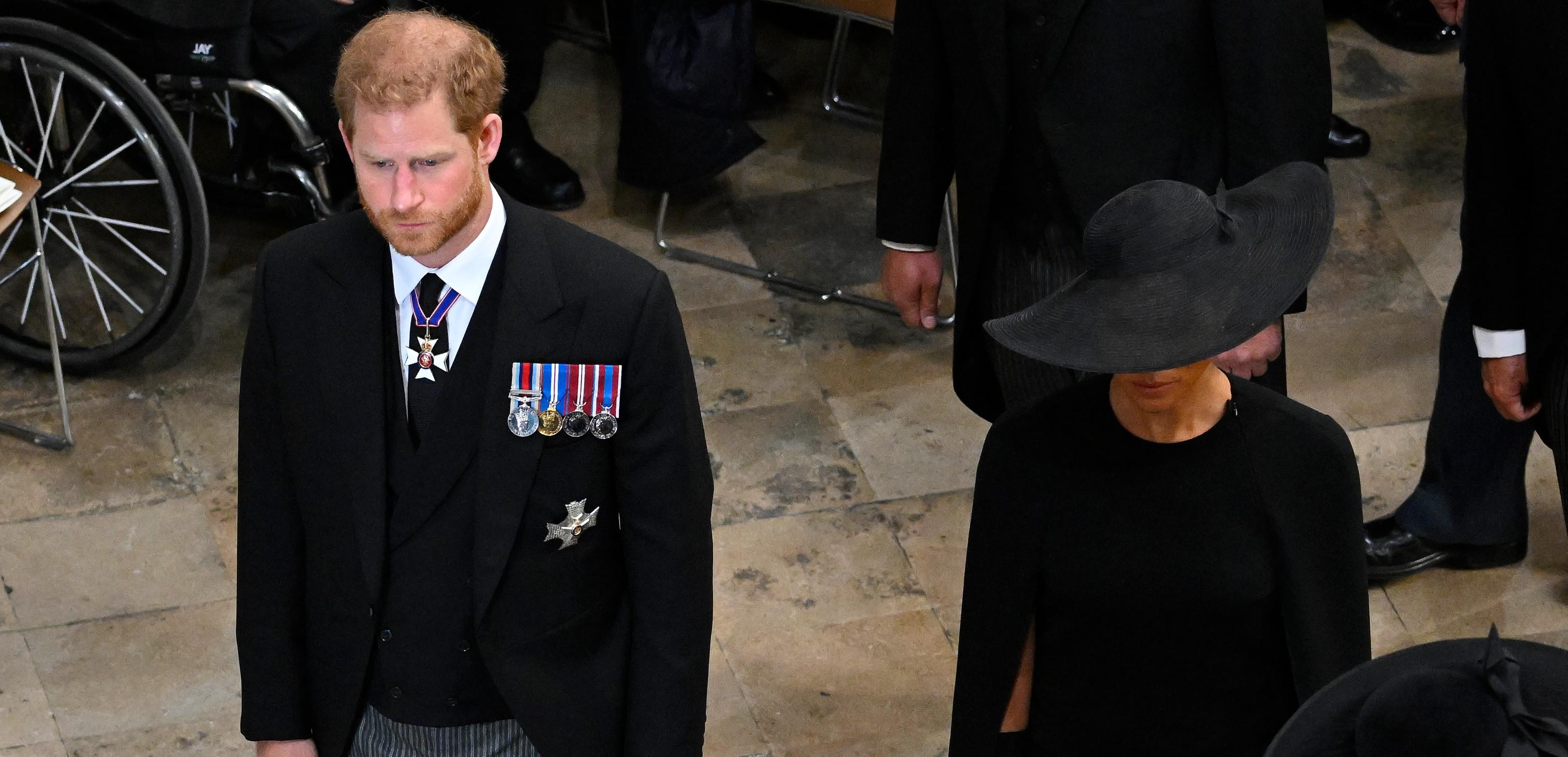 : Prince Harry, Duke of Sussex and Meghan, Duchess of Sussex departing Westminster Abbey during the State Funeral of Queen Elizabeth II