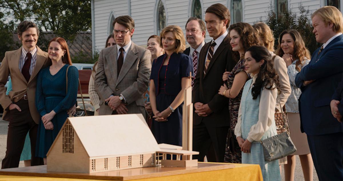 The cast of 'Love & Death' standing outside of a church in front of a model of a church