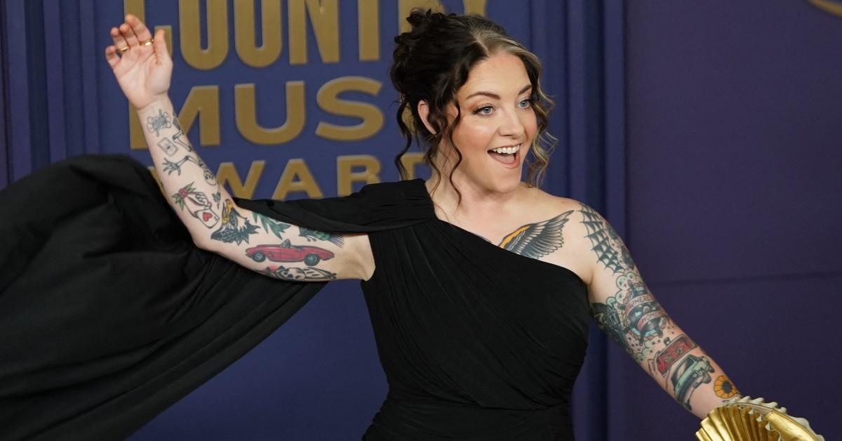 Ashley Mcbryde waving while attending the award ceremony