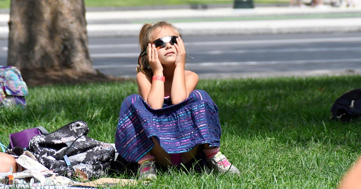 Little girl wearing protective eyewear outside Franklin Institute, in Center City Philadelphia, PA to see the Solar Eclipse, on Aug. 21, 2017