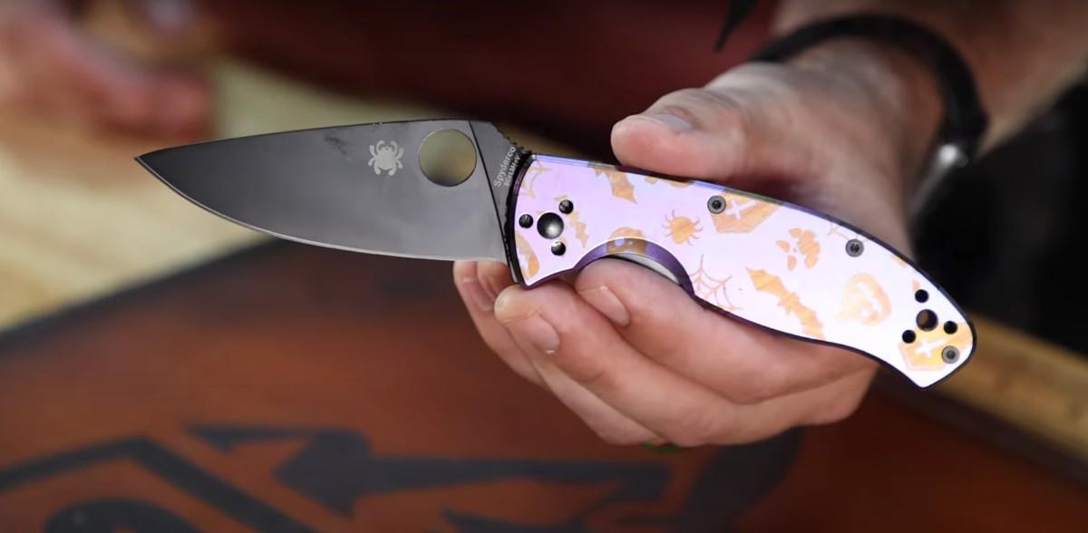 A hand holding a Halloween pocket knife