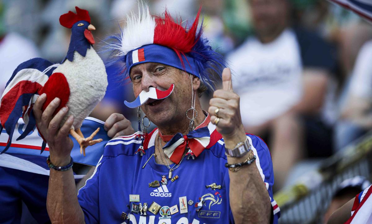 man with rooster french football team france