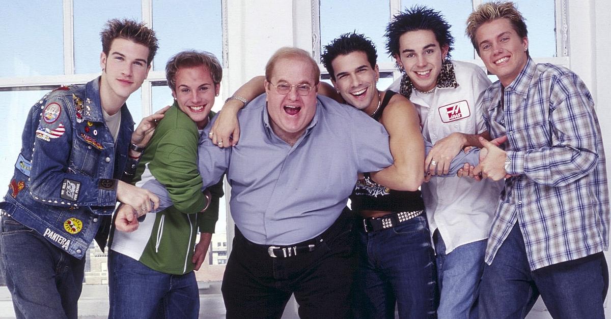 Lou Pearlman poses with boy band O-Town in 2001