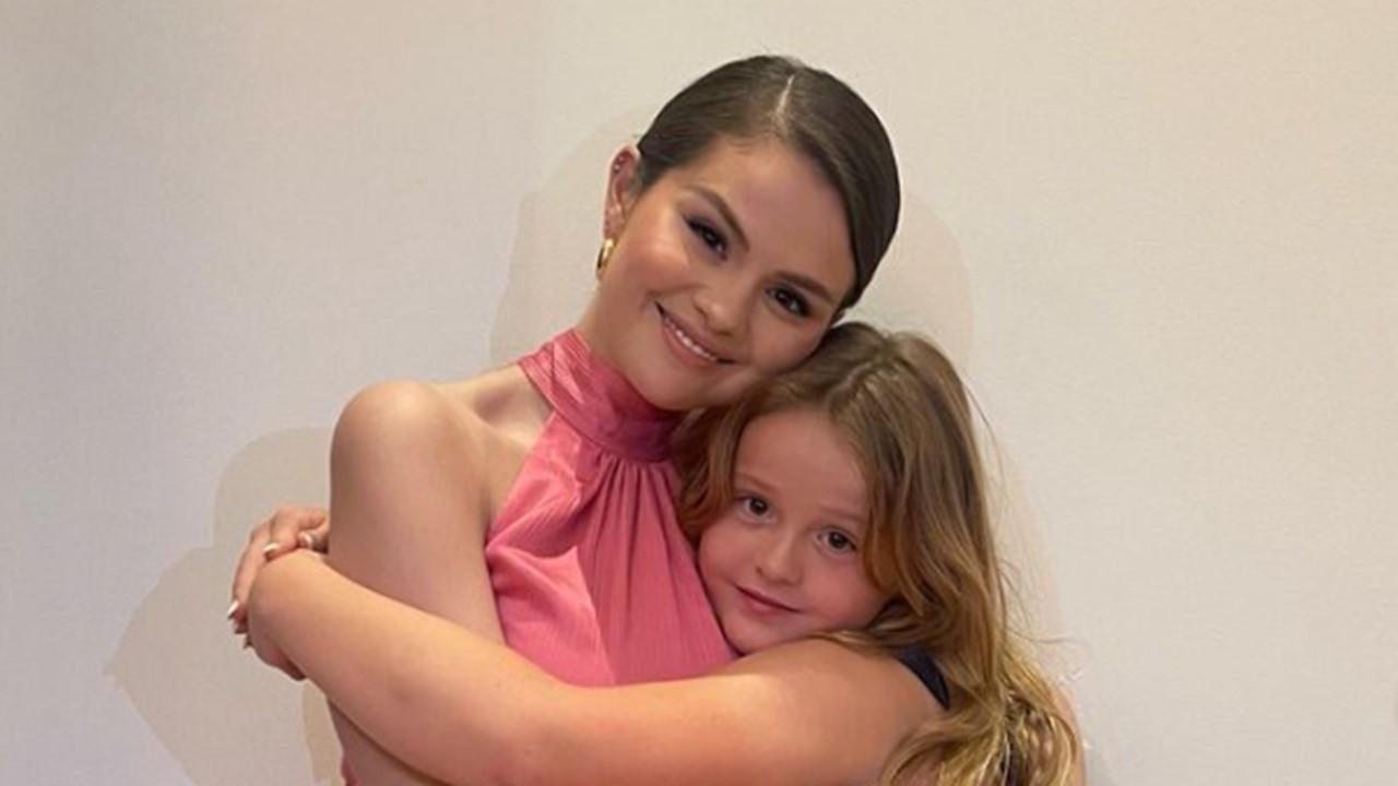 Selena Gomez giving her little sister Gracie a hug