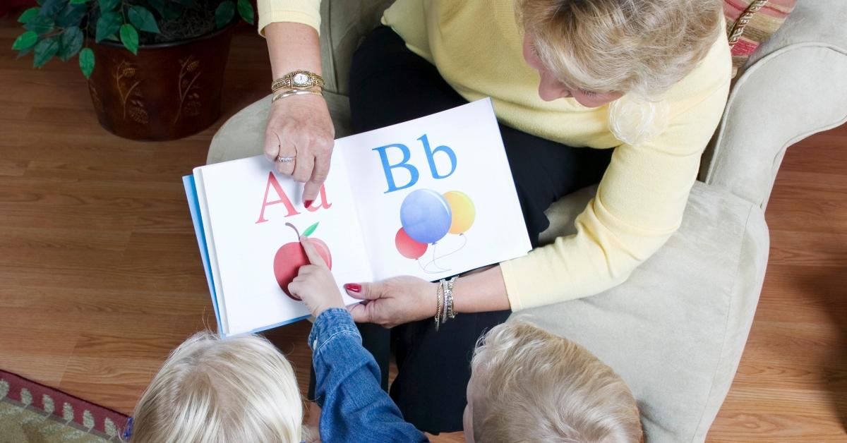 grandmother reading to her grandchildren