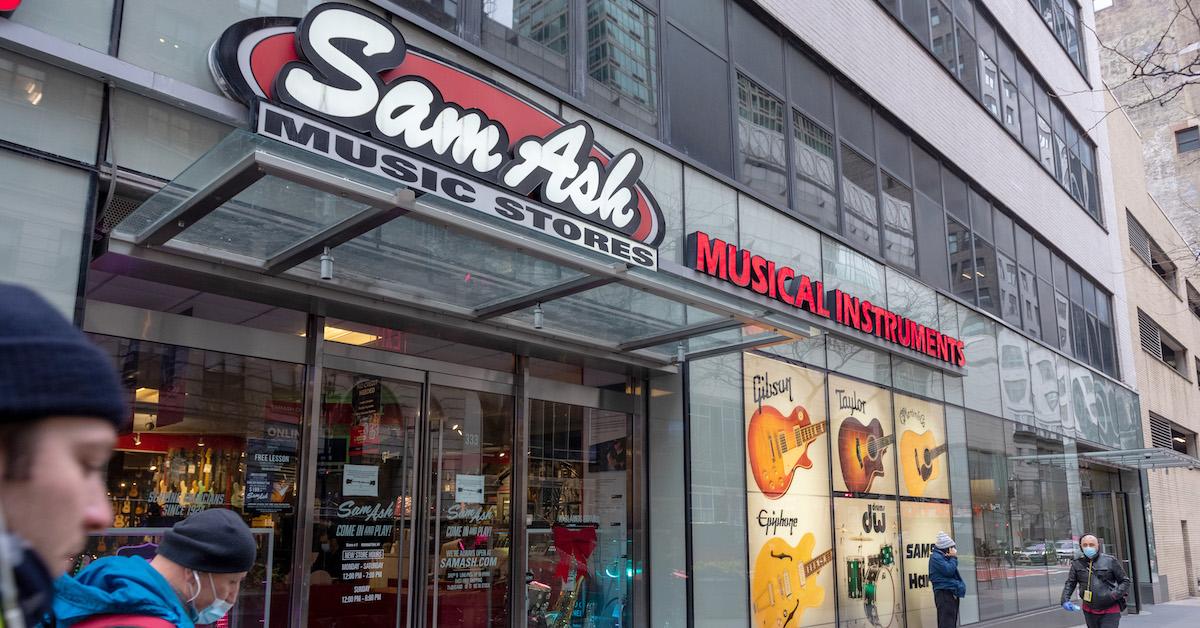 A Sam Ash store in New York City with people walking by