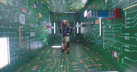 Quinn stands in a room made of circuit boards on Big Brother 26