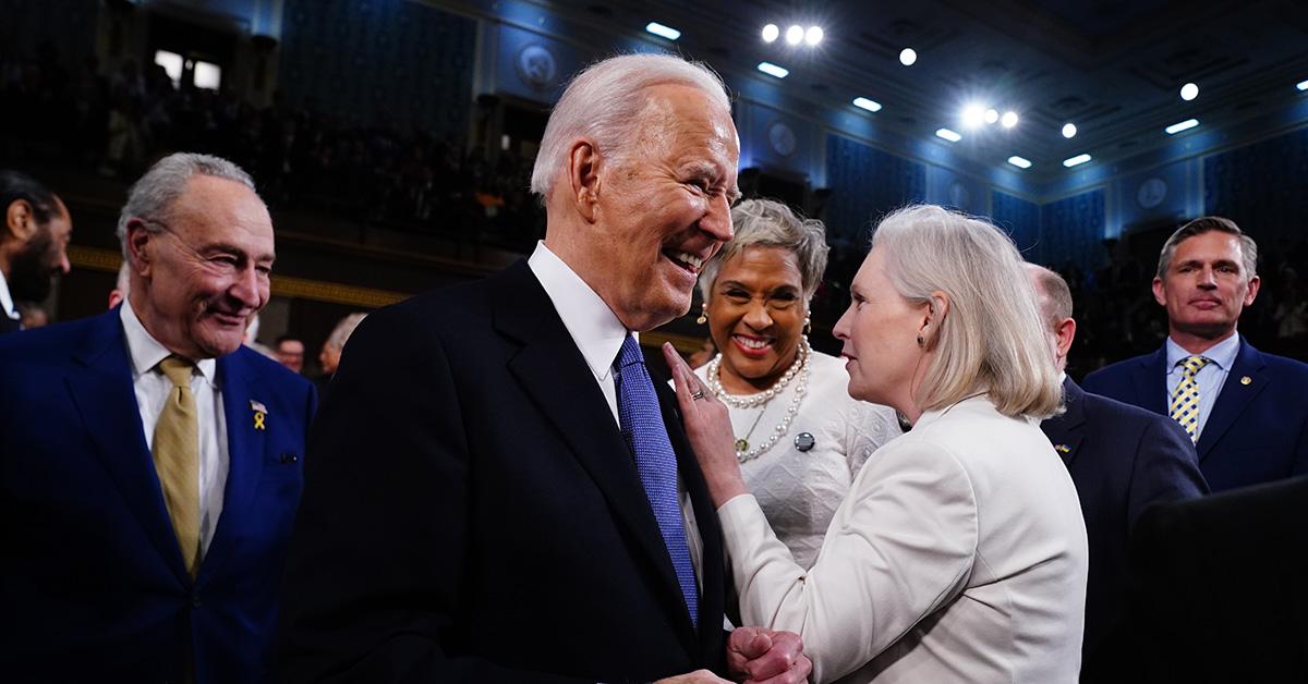 President Biden arrives at the 2024 State of the Union, flanked by Kirsten Gillibrand and Chuck Schumer. 