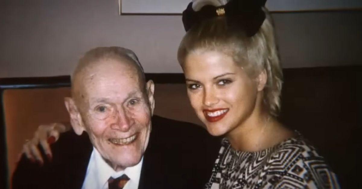 J. Howard Marshall and Anna Nicole Smith smiling and sitting next to each other